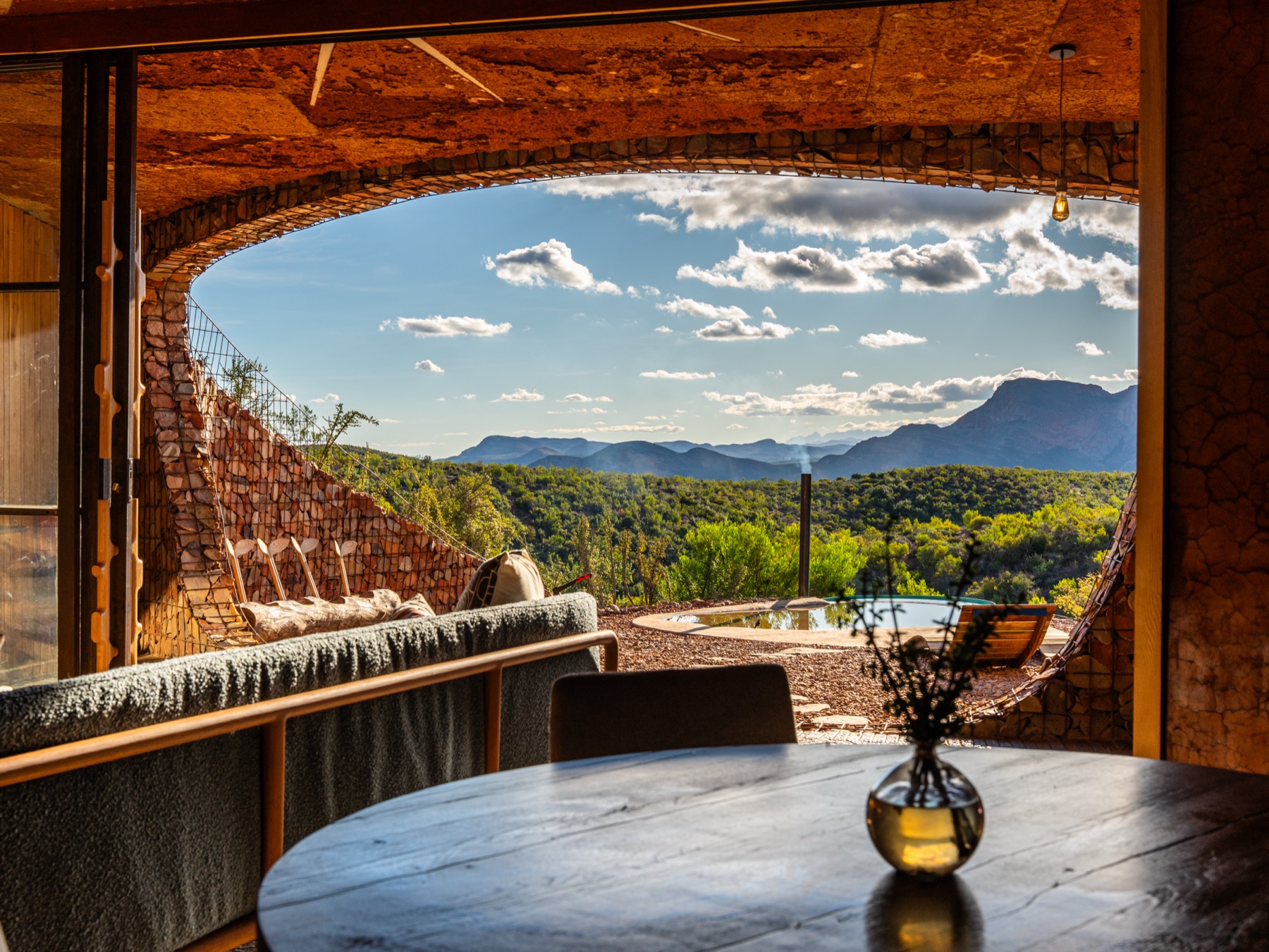 Lodge dining area with a bushveld view — hospitality photography