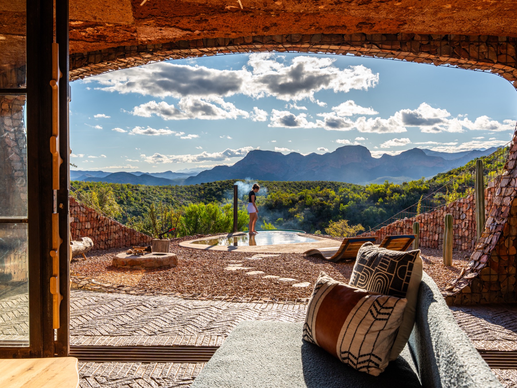 Luxury lodge plunge pool and mountain panorama — hospitality photography