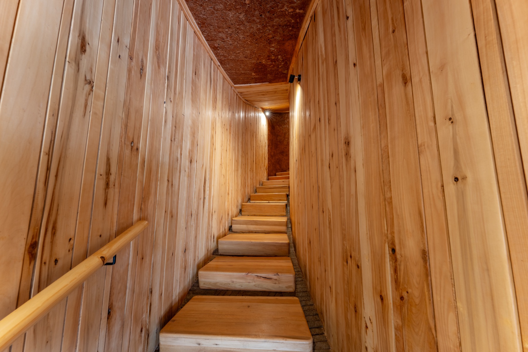 Timber-clad stairway — lodge interior photography